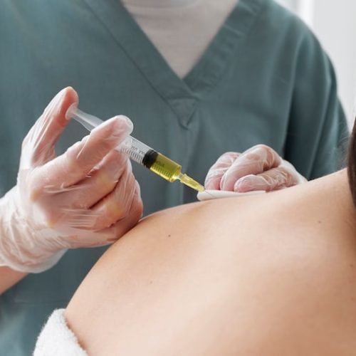 side-view-healthcare-professional-injecting-neck_23-2149404727